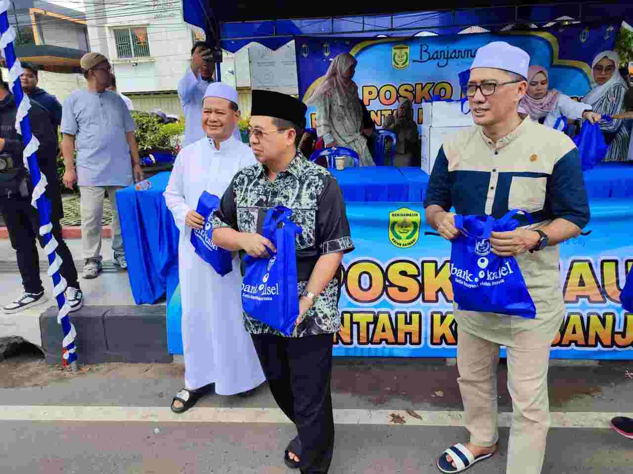 Sambut Jemaah Haul Guru Sekumpul, Pemko Banjarmasin Gandeng Bank Kalsel Bagikan Konsumsi